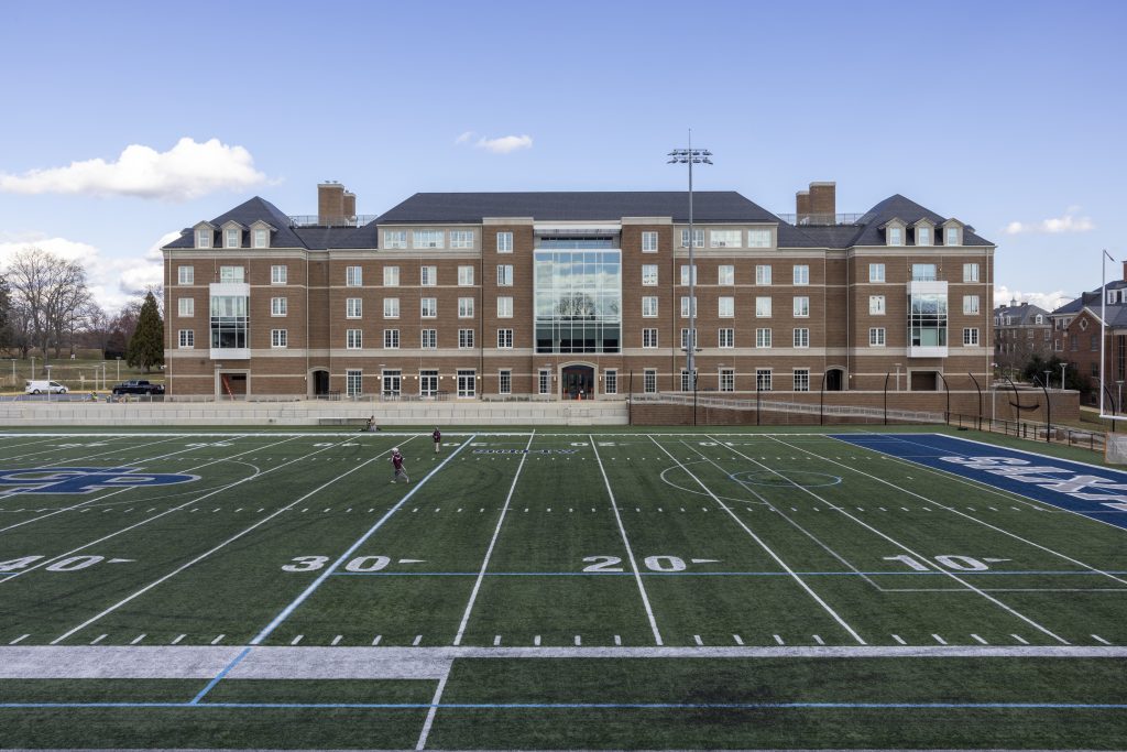 West facing view of the Campus Center & Residence Hall from the stadium