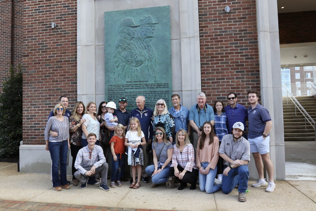 The Fegan family at the bronze plaque dedication of Coach Fegan and the late Rev. Aloysius C. Galvin, S.J.